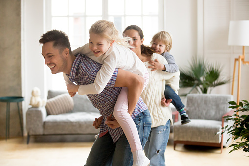 Happy family at home Family enjoying clean air in Alabama home